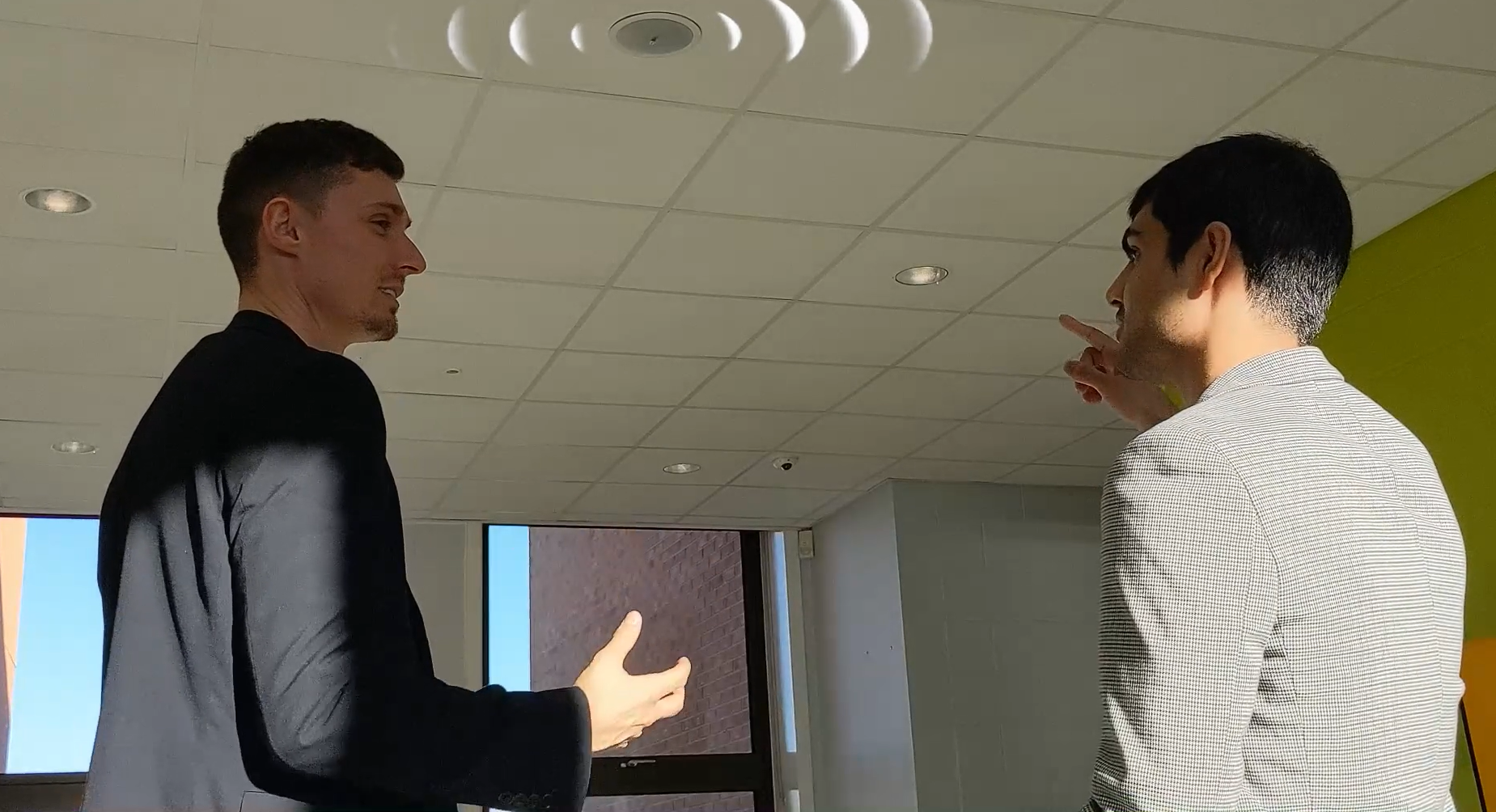 ICT Technician Maaz Melia and Oscar Rowley in conversation about the Audiebant lockdown system, illustrating its multi-zone broadcasting capabilities
